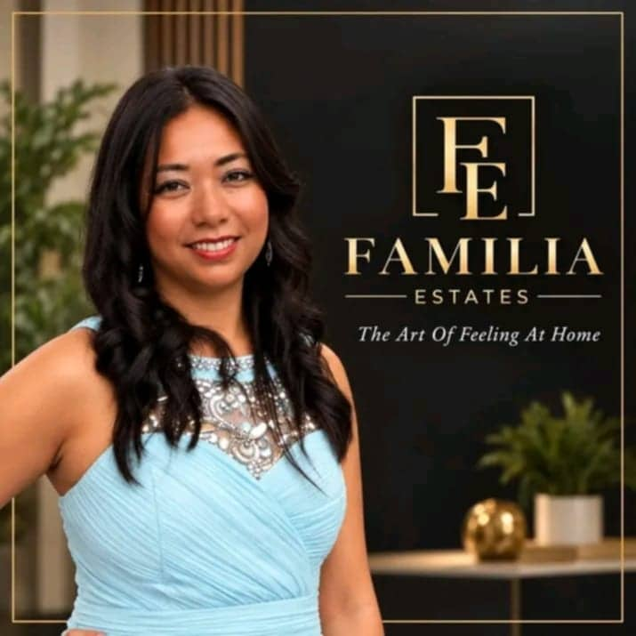 The founder of Familia Estates beside the company logo