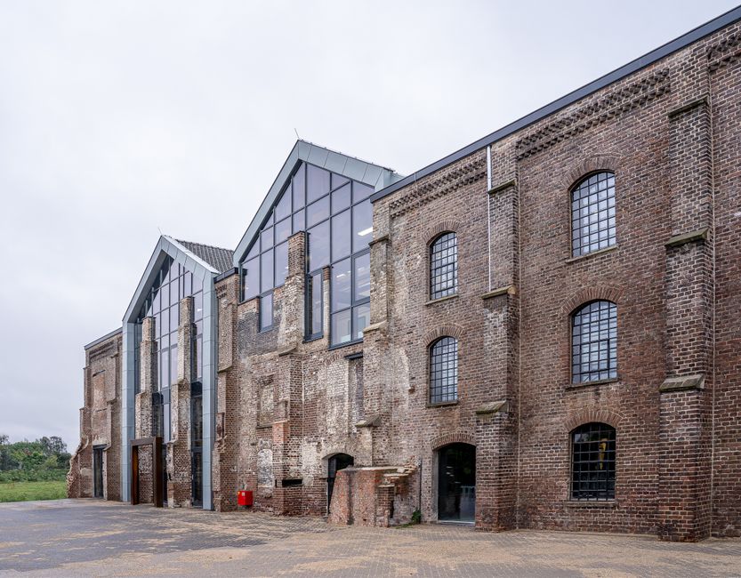 Converted brick warehouse with a modern glass frontage