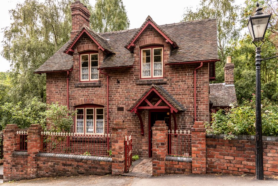 Brick semi-detached house with a front garden